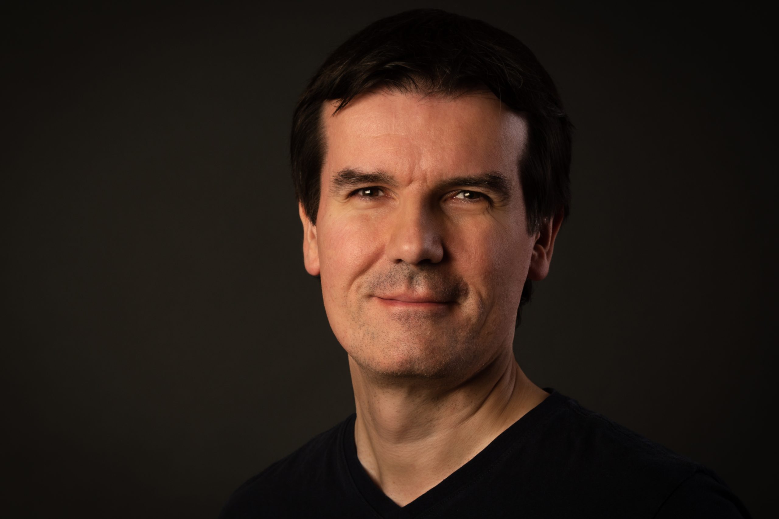 Andreas Döring vor schwarzem Hintergrund